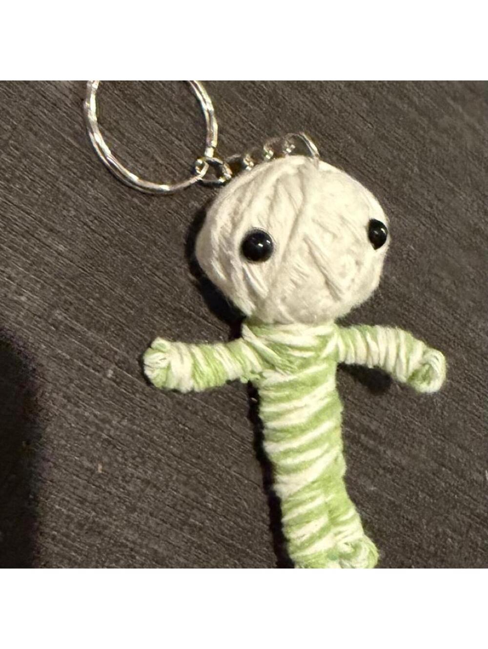 Cute little yarn voodoo keychain. Green & white yarn doll keychain.